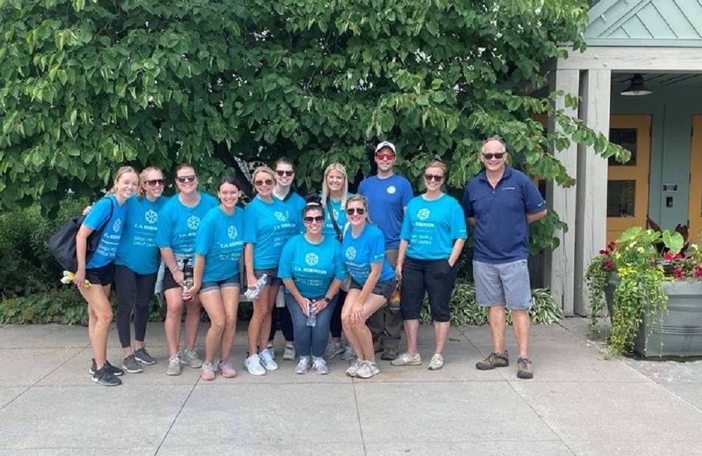 The Communications Team gather to volunteer at the local arboretum and enjoy the summer sunshine. 