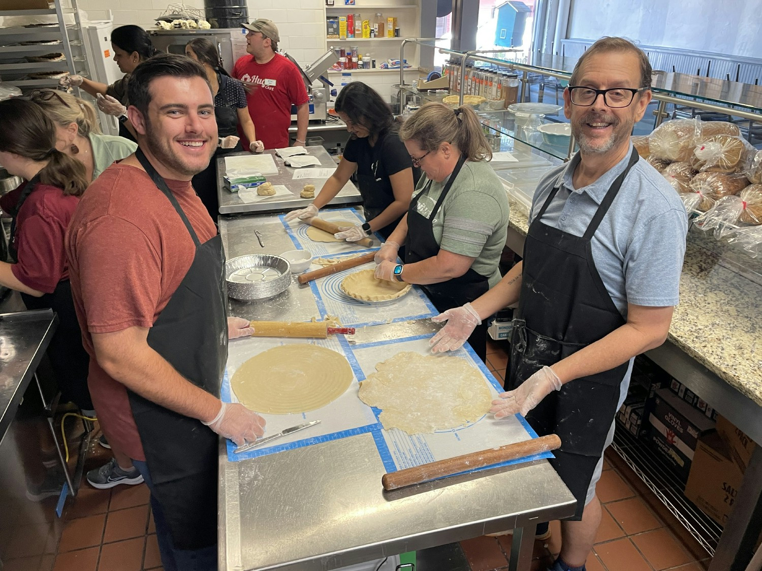 Hugs Cafe trains and employs adults with disabilities. Capital One associates helped bake pies sold at the holidays