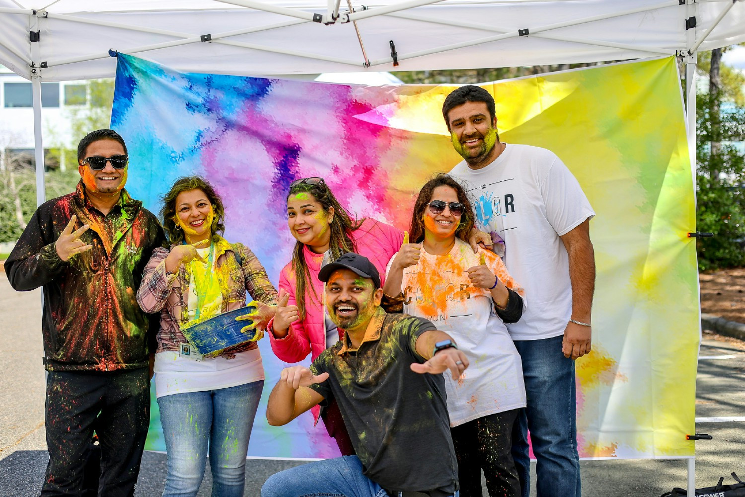 Members of ICON, one of Cisco’s 30+ Inclusive Communities, host a color run with LifeConnections Fitness Center at RTP. 