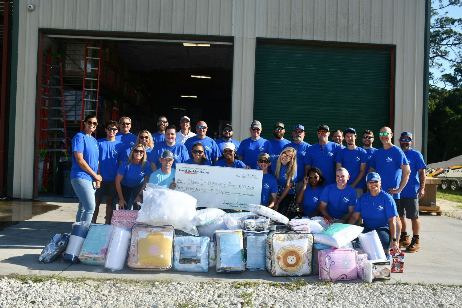 Houston division Team Members build bunk beds for children with Sleep in Heavenly Peace