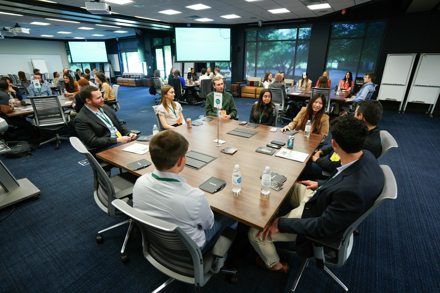 Live sessions at Deloitte University bring participants together for development workshops.