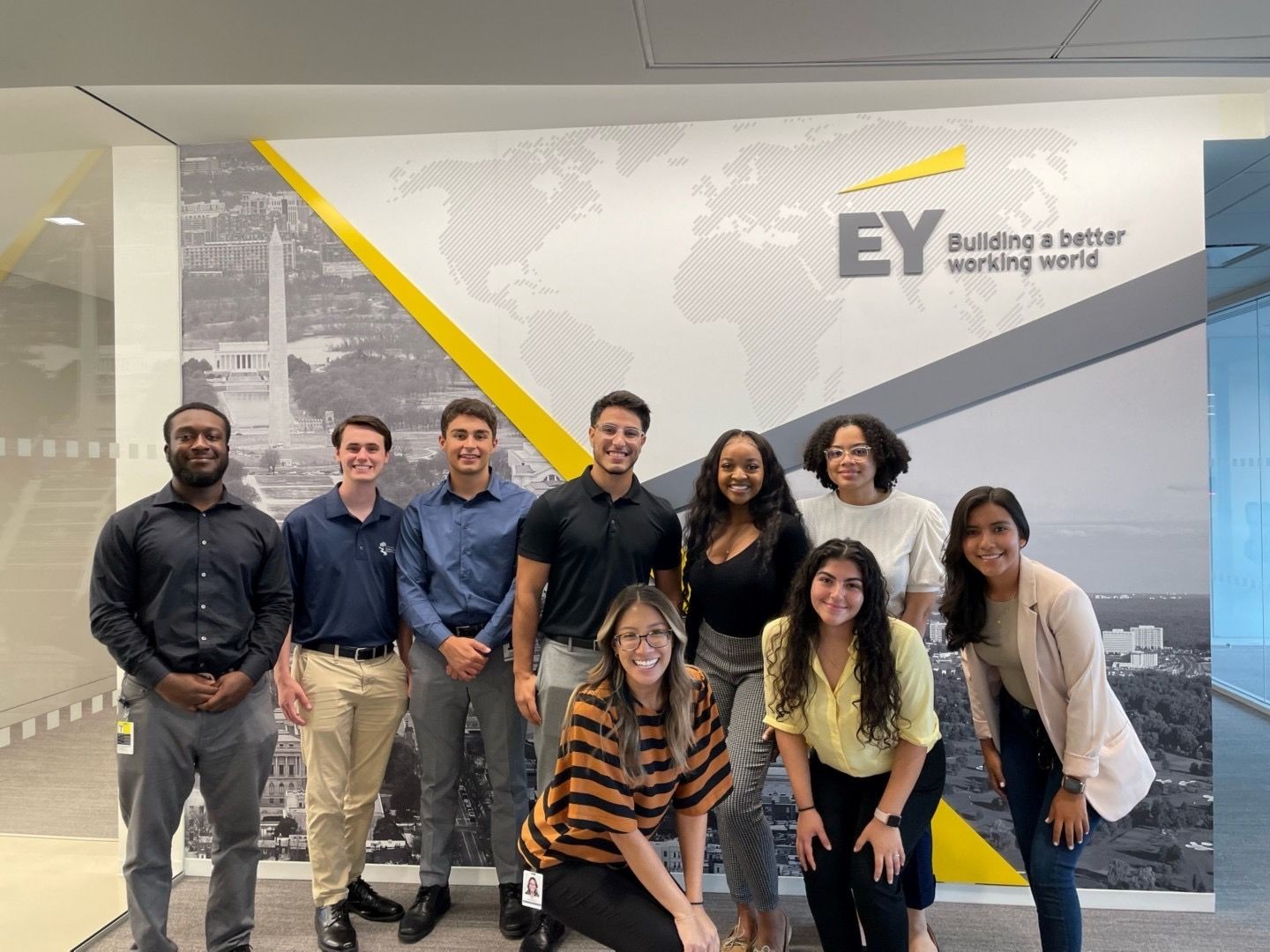 An EY team comes together for a “moment that matters” in the Tysons office.