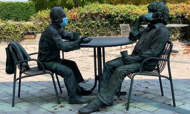 A statue of our founders, Herb Boyer and Bob Swanson (masked) sits in the courtyard of our Founders Research Center.