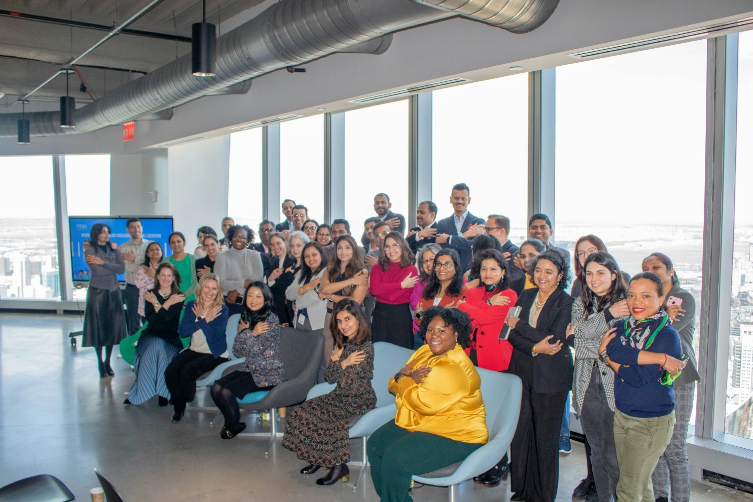 Infosys employees gather together at its New York City office on International Women's Day on March 8th 2023.