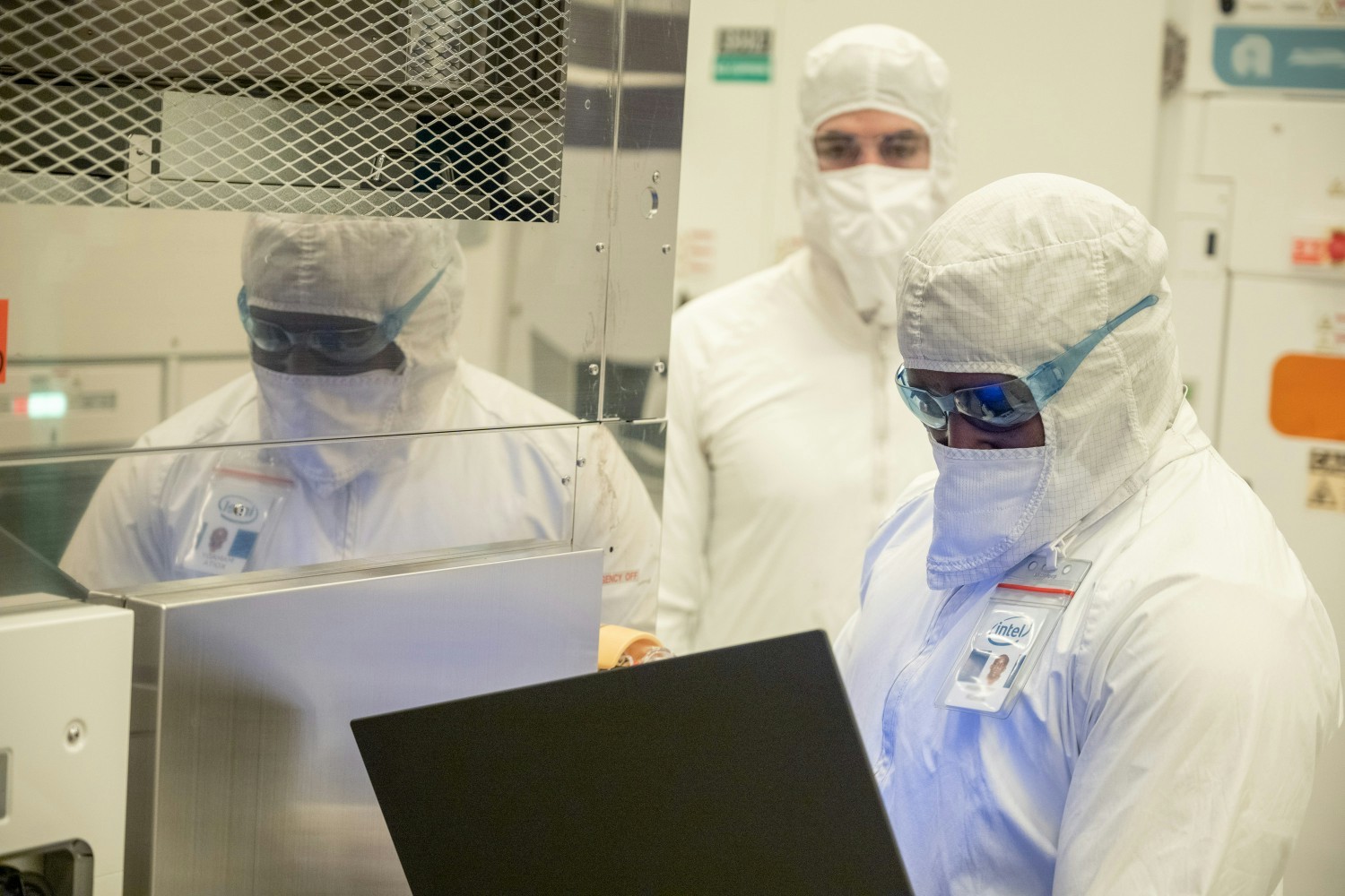 Intel employees working inside of one of the company's fabrication plants.