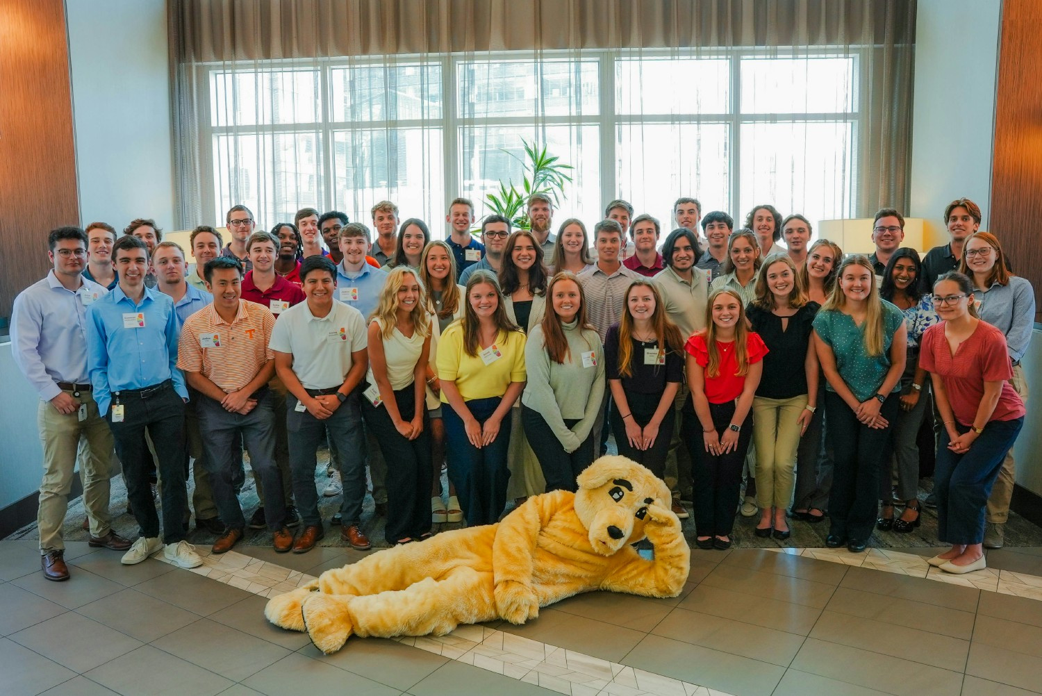 Say cheese! Our summer interns snap a photo with Scrappy on Intern Day.
