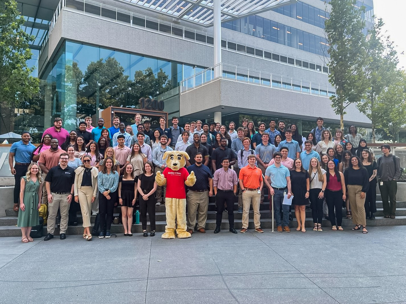 Our summer interns pose with everyone's best friend, Scrappy, on South's Intern Day.