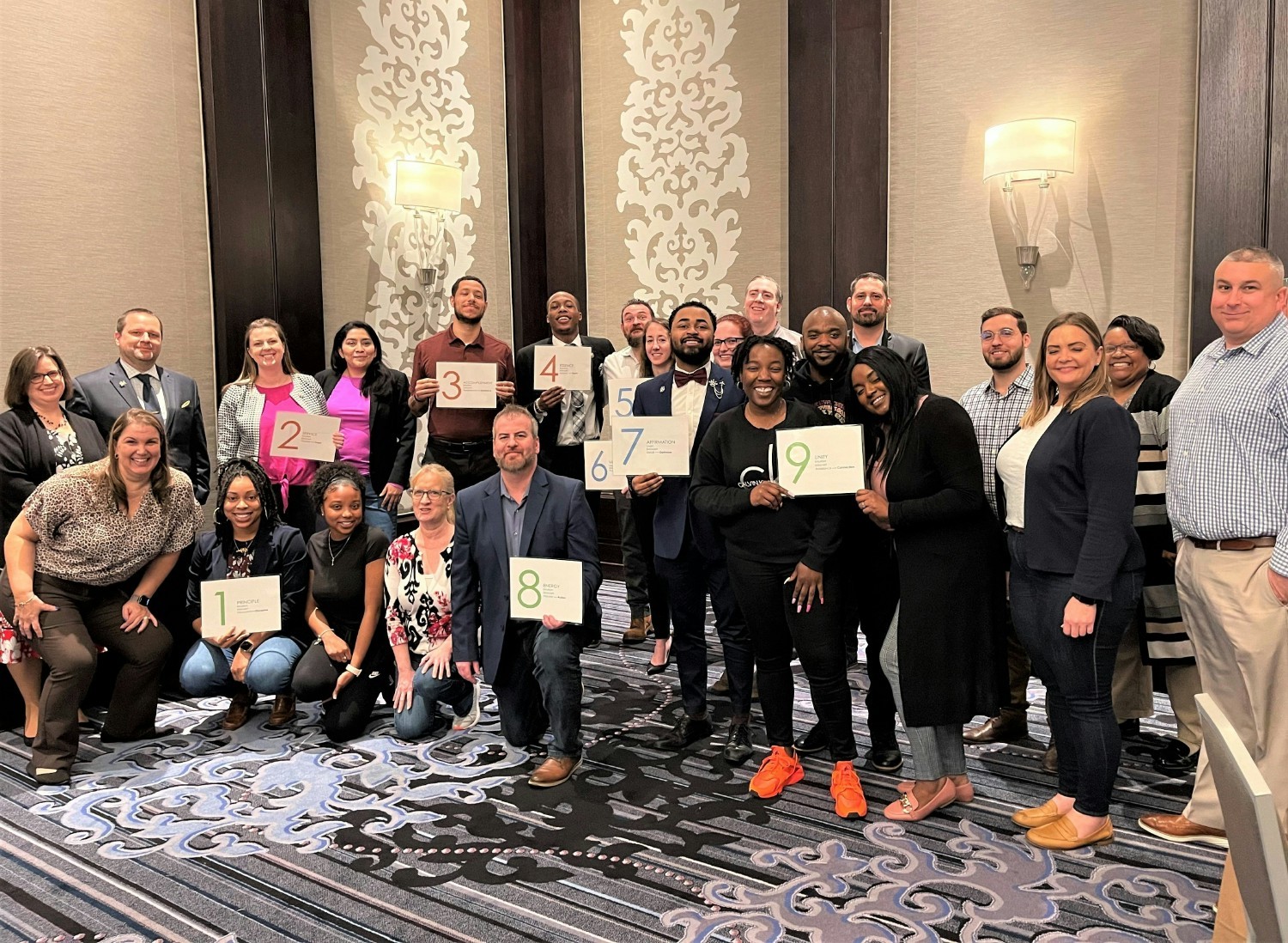 Employees attending the Kimpton Cultural Cornerstone Class Nine Doors at the Tryon Park Hotel in Charlotte, NC.