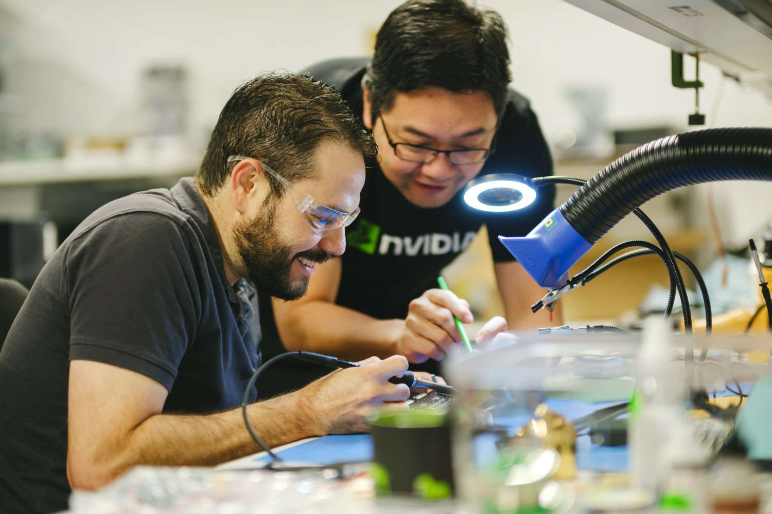 NVIDIANs work on our self-driving car technology in the automotive lab.