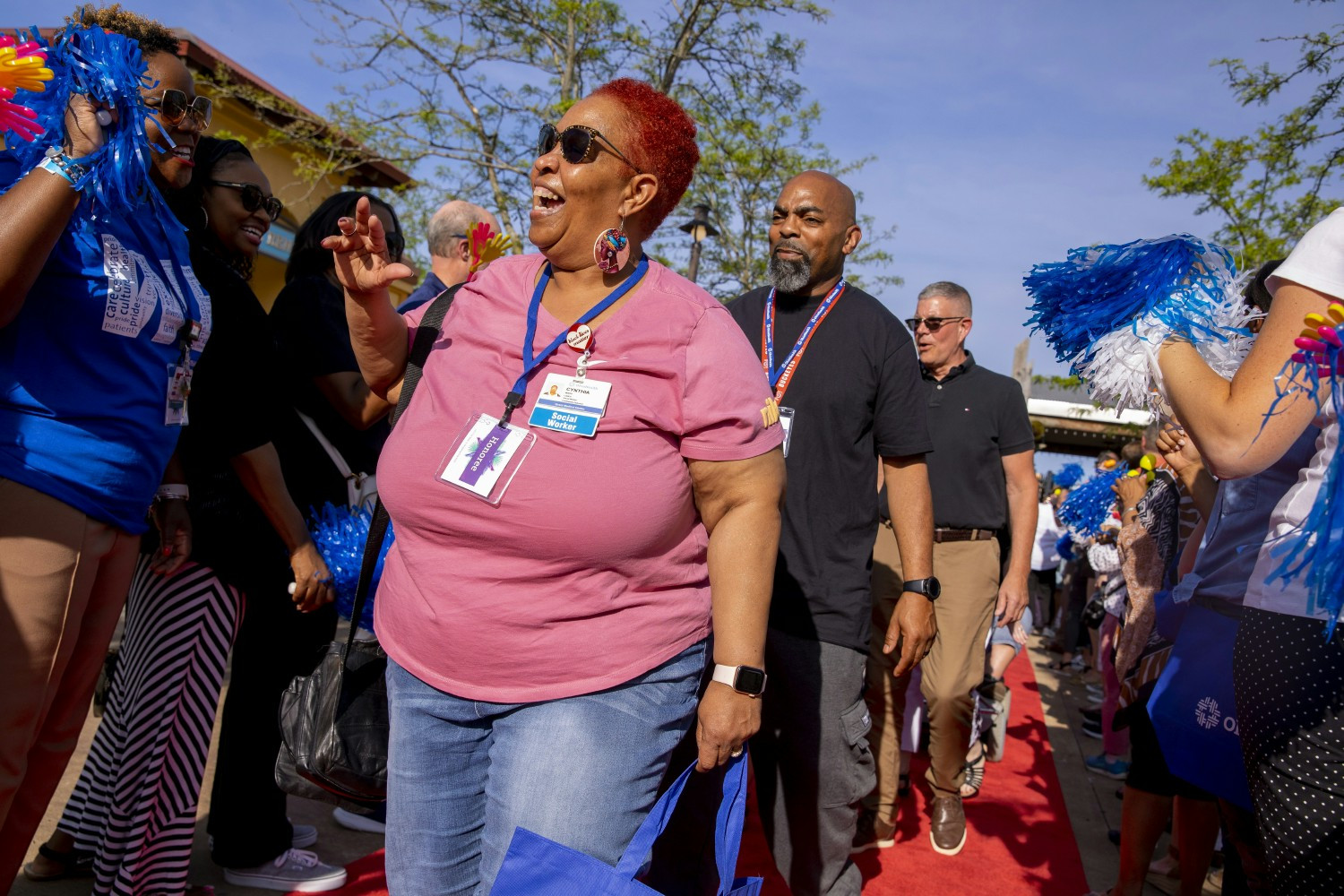 An honoree walking the red carpet at OhioHealth Shopping Trip celebrating 20+ year tenured associates.