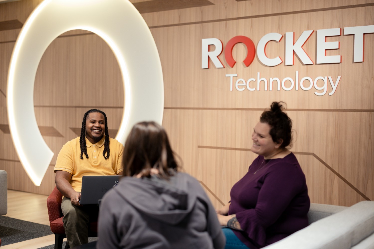 Team members participate in a lively discussion in a recently-renovated Rocket Technologies space.