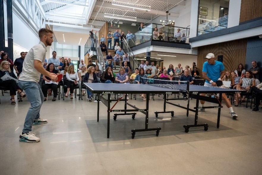 A Toll Brothers employee facing off against our CEO in our Ping Pong Championship