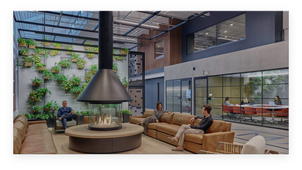 Employees take a break near the fireplace at the Toll Brothers Corporate headquarters in Fort Washington, PA
