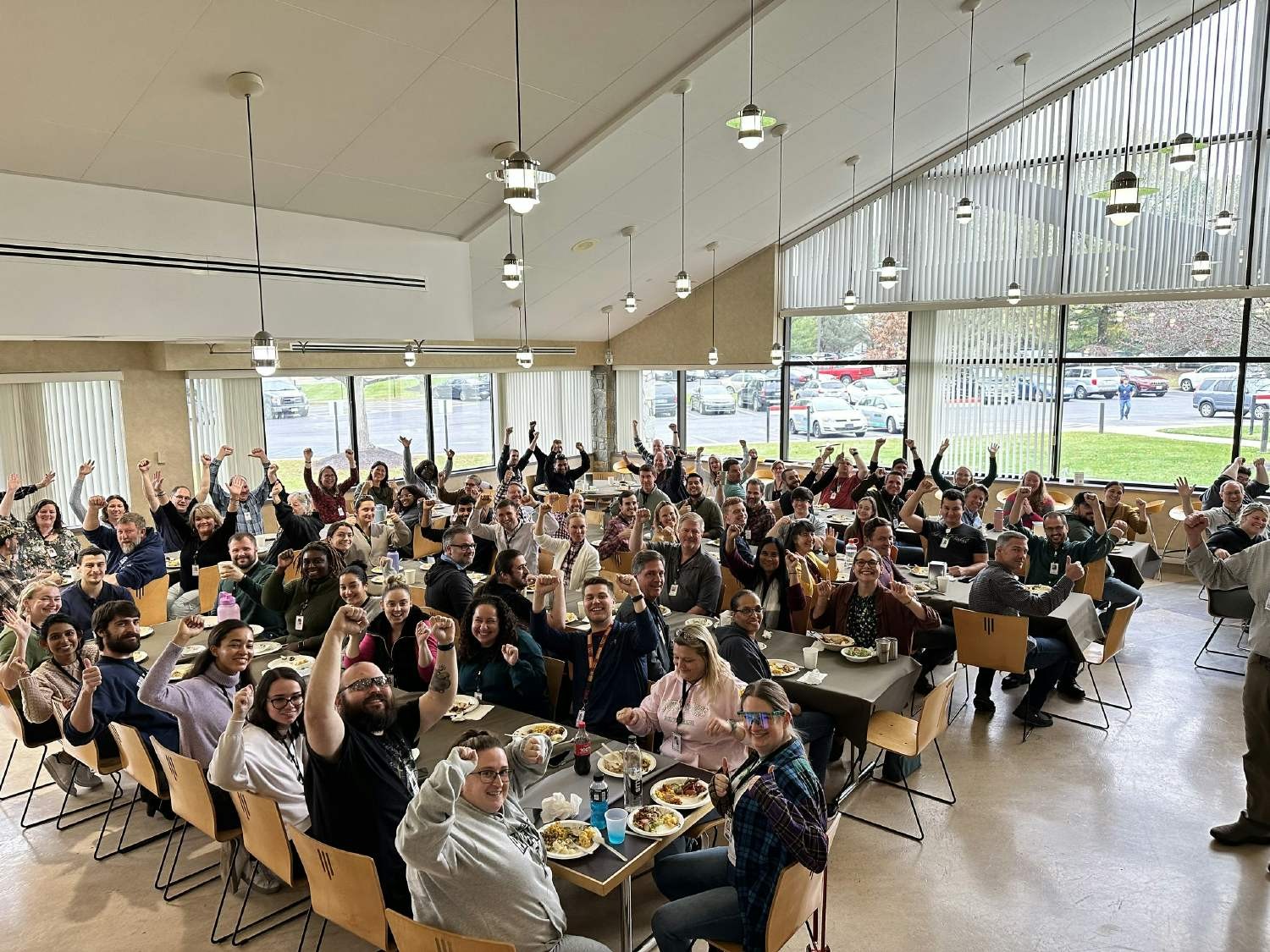 Associates gather for a holiday lunch and celebrate the announcement of a profit share.