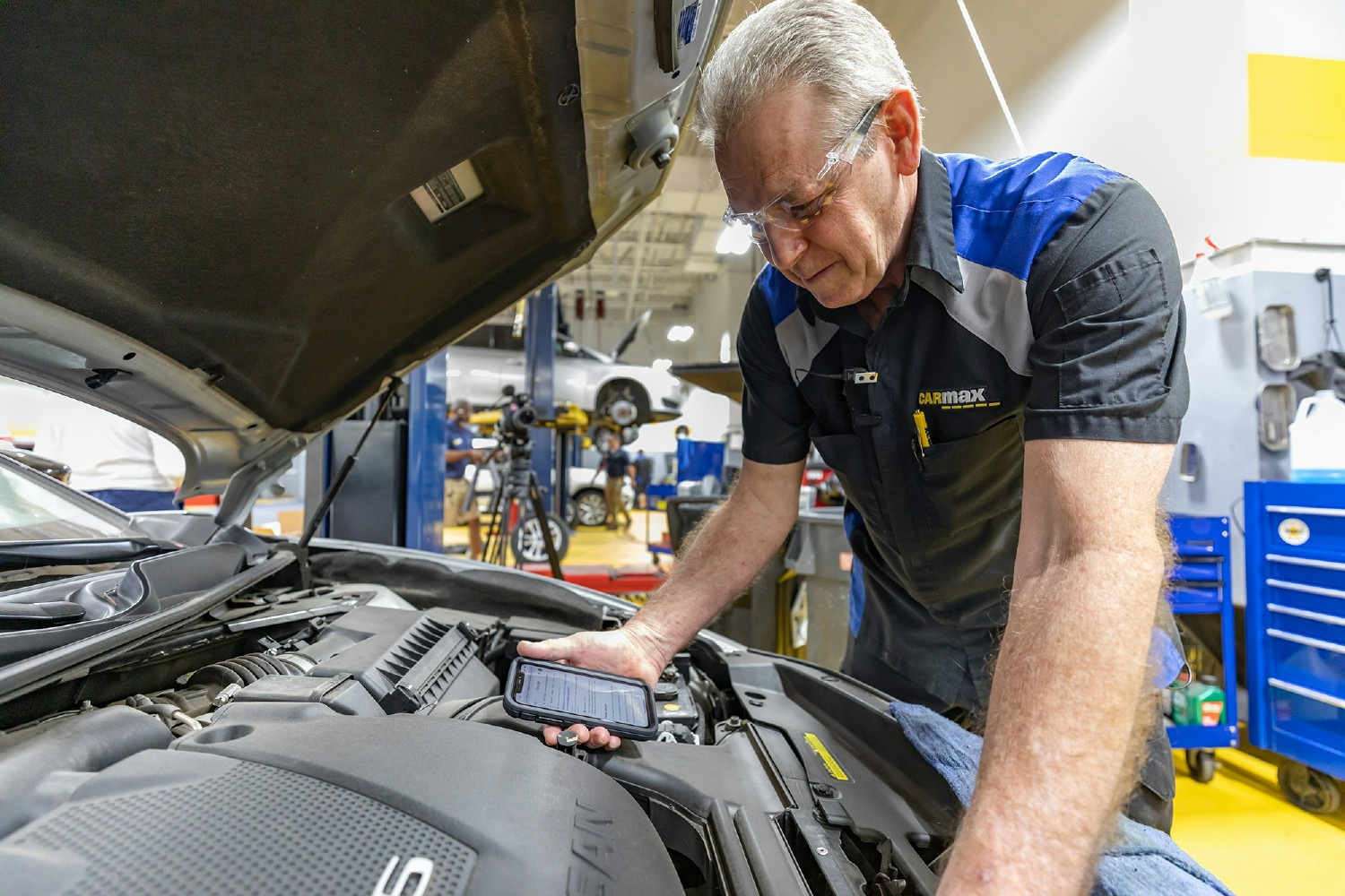 Mechanical Associate Justin Raley learns skills to recondition vehicles ensuring cars meet standards for sale. 