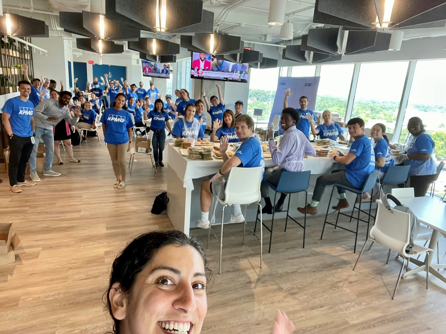 KPMG volunteers in Washington DC make sandwiches to support neighbors in need during KPMG's Community Impact Day.