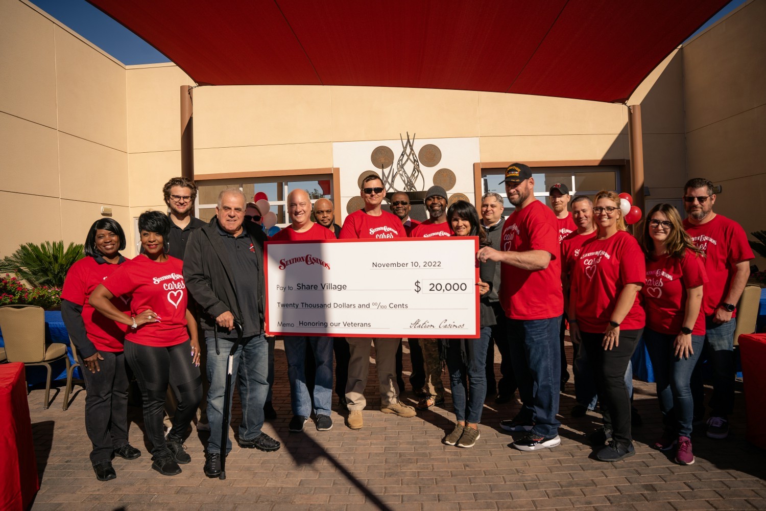 Team Members present founder of SHARE Village, Arnold Stalk with $20k donation
