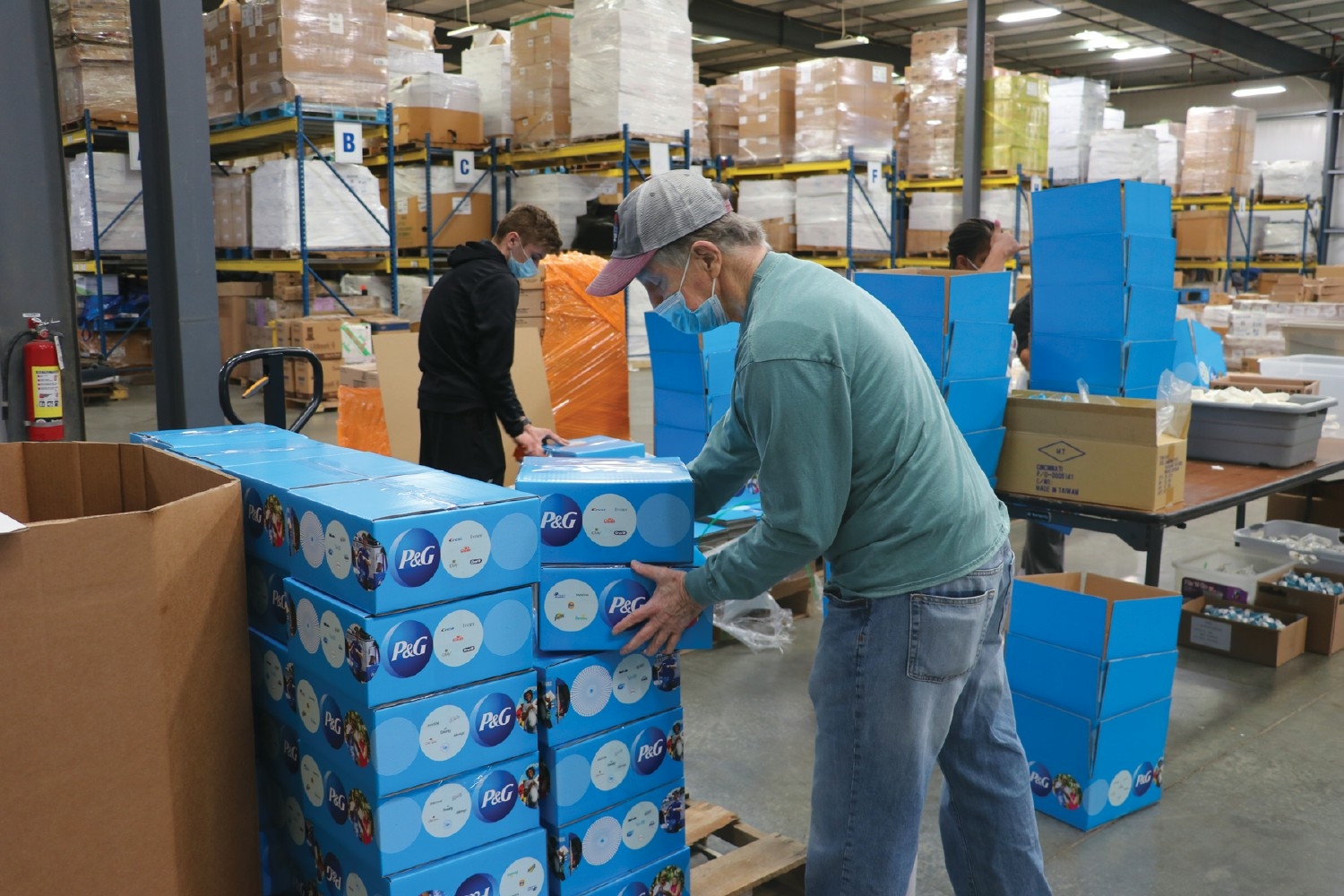 P&G employee packs donation boxes to support communities in need