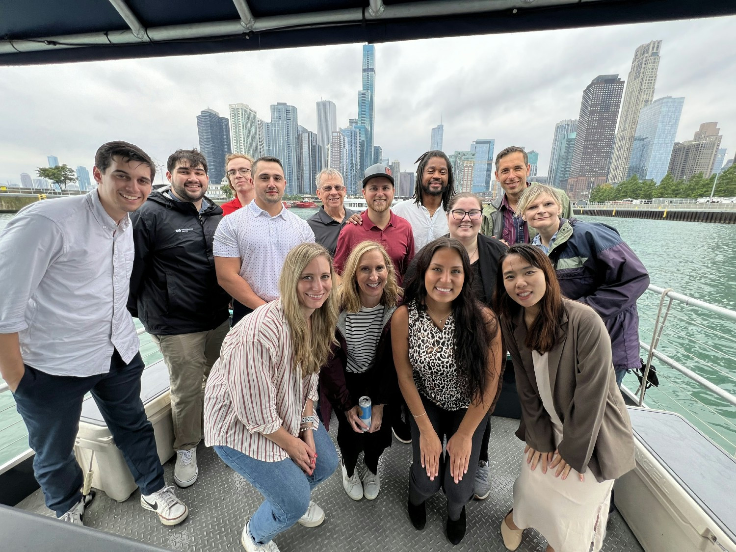 Colleagues pose for a photo at an onsite happy hour.