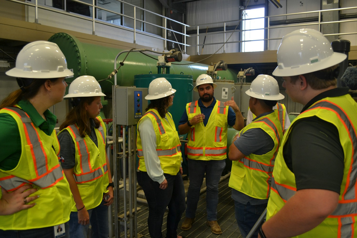 Project site visits, like this one to a water treatment plant, show interns how their careers benefit the real world. 