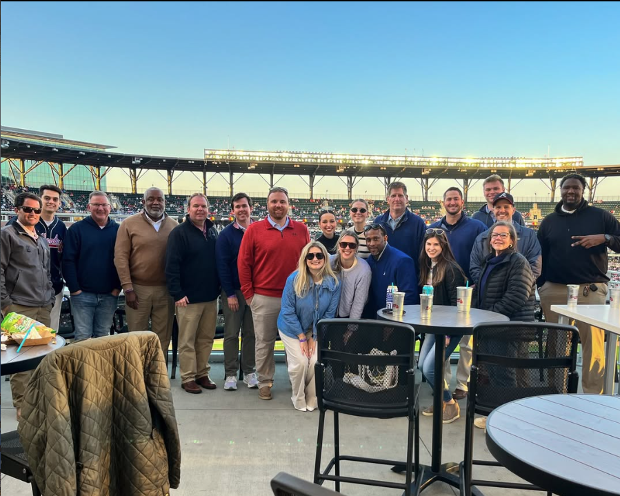 Employees from our Birmingham and Atlanta offices enjoying an evening at Truist Park for some Braves baseball.