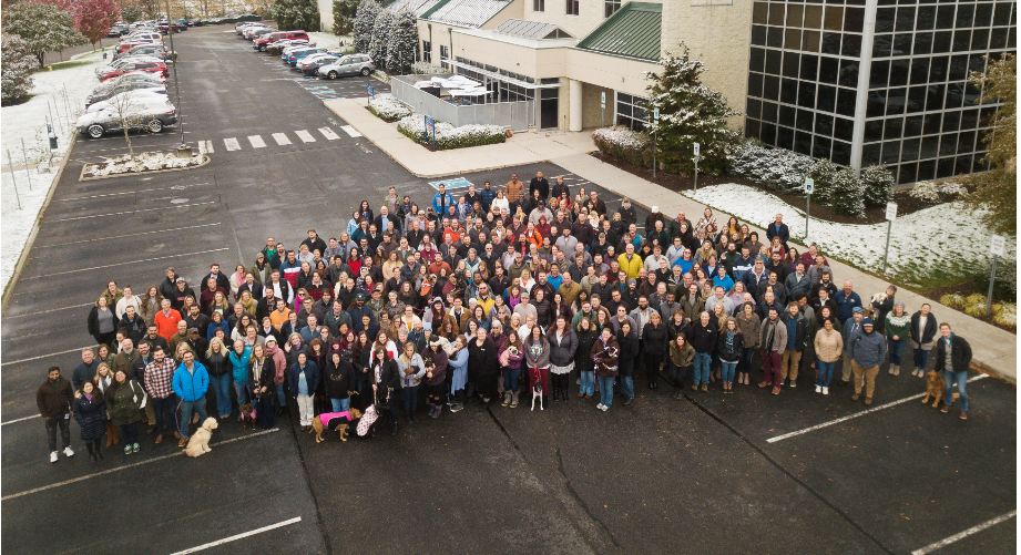 Teammates gather before a Global Community Meeting