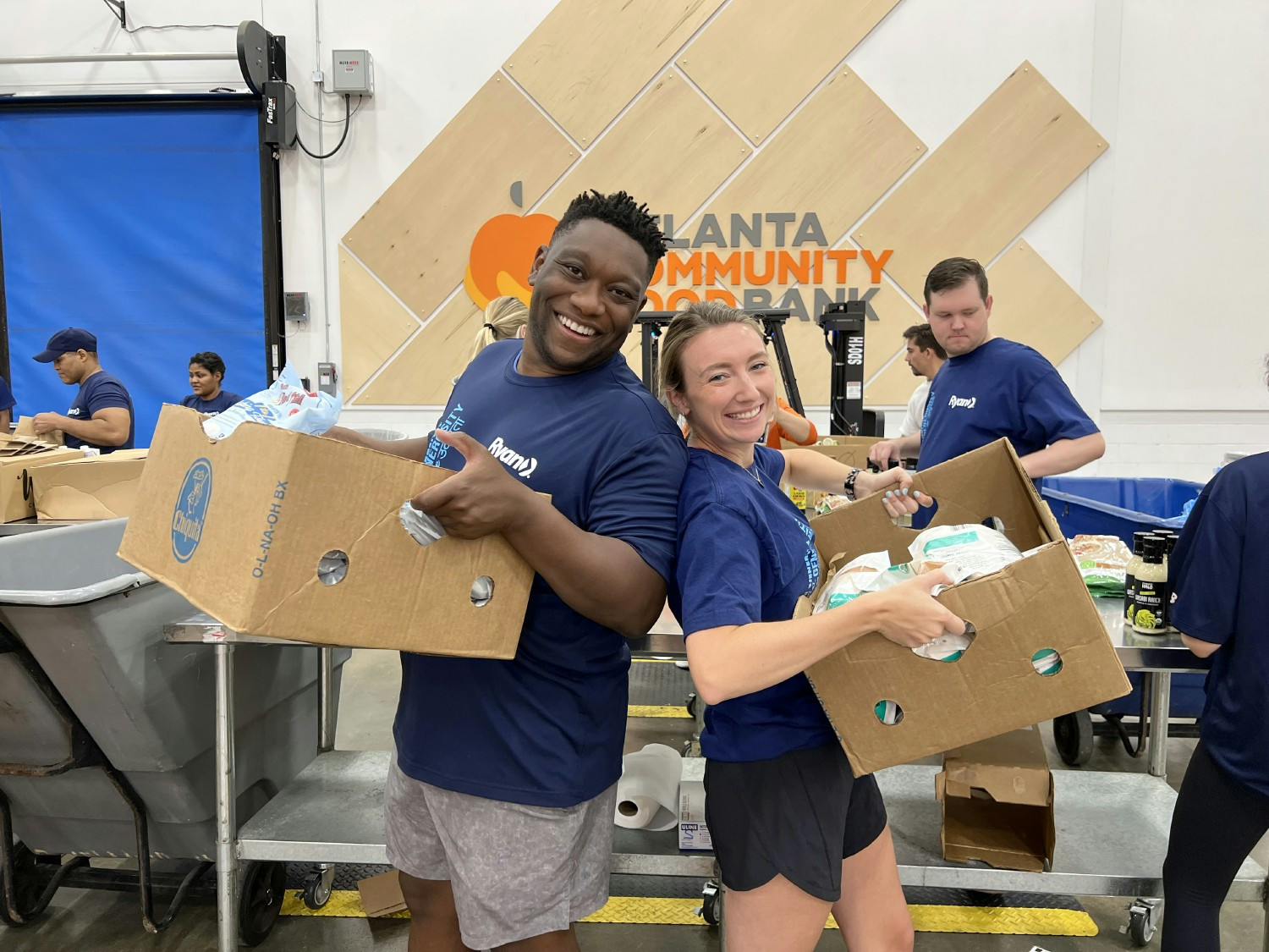 Ryan team members volunteer together for RyanSHARES Day at the Atlanta Community Food Bank. 