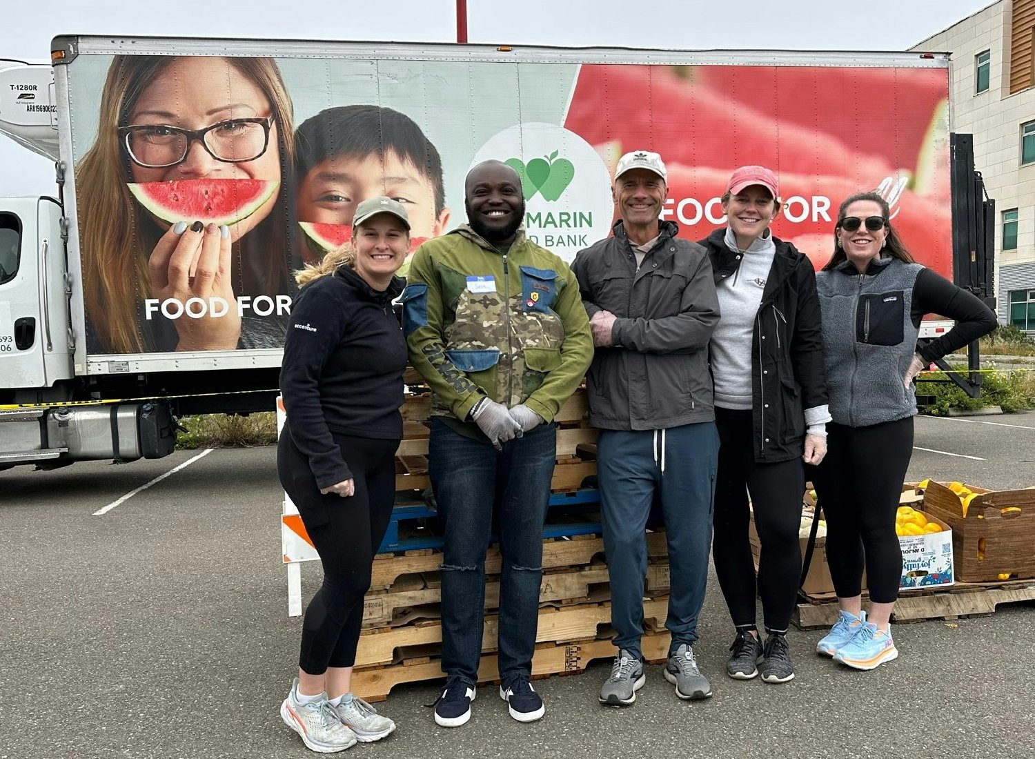 Northern California week of service volunteers distribute fresh produce at the San Francisco-Marin Food Bank .
