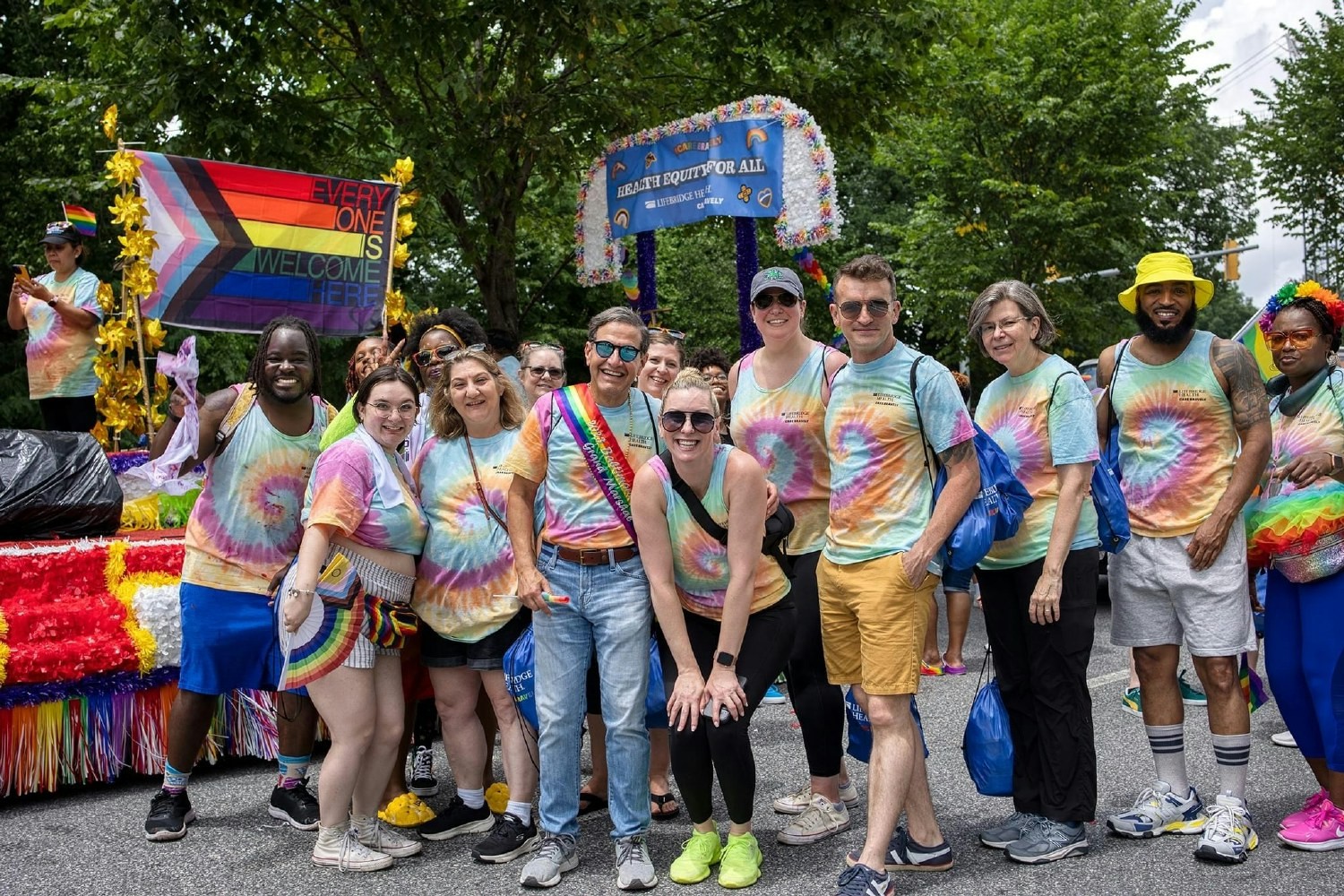 LBH team members celebrating Baltimore Pride with the parade's Grand Marshall, our CEO Neil Meltzer