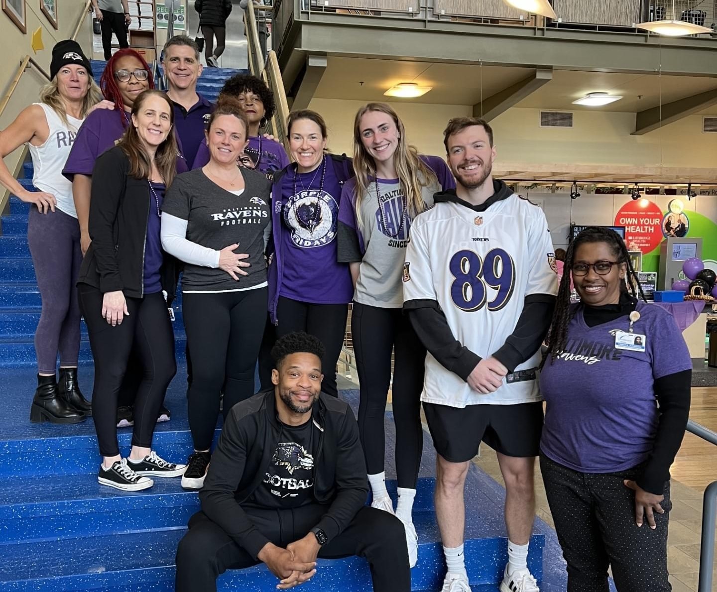 LifeBridge Health & Fitness team members celebrate Purple Friday and the Raven's  AFC North Championship