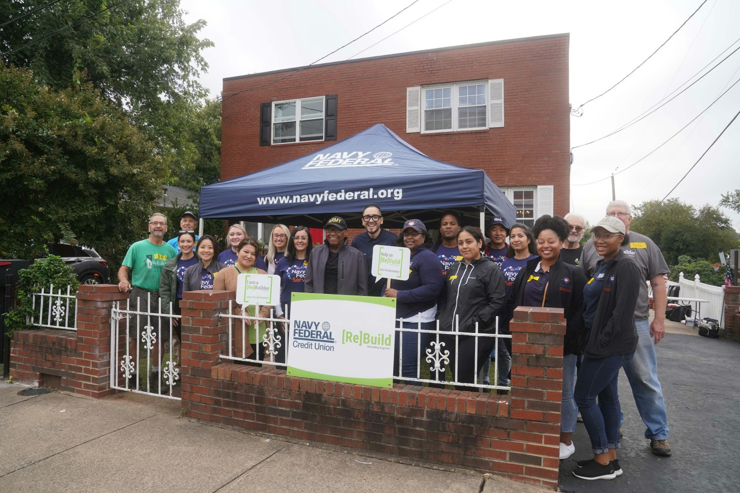 Navy Federal employees assist with home repairs for a veteran in partnership with Rebuilding Together in Arlington, VA.
