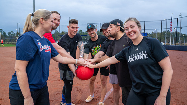 Employees playing a game of kickball at the new Navy Federal Recreation Center.
