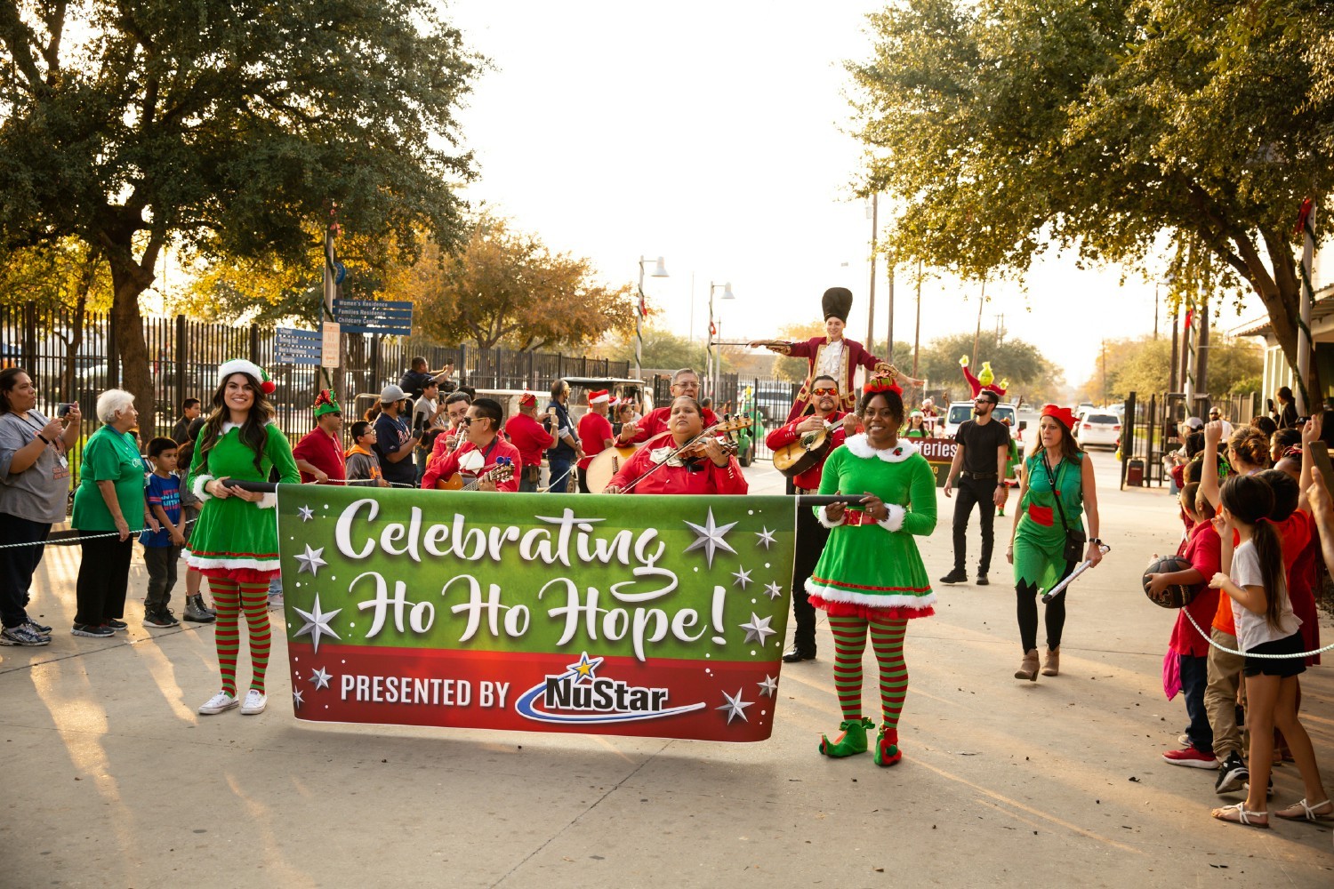 Employees organized a special Christmas celebration at a homeless facility - complete with a parade, dinner and gifts!