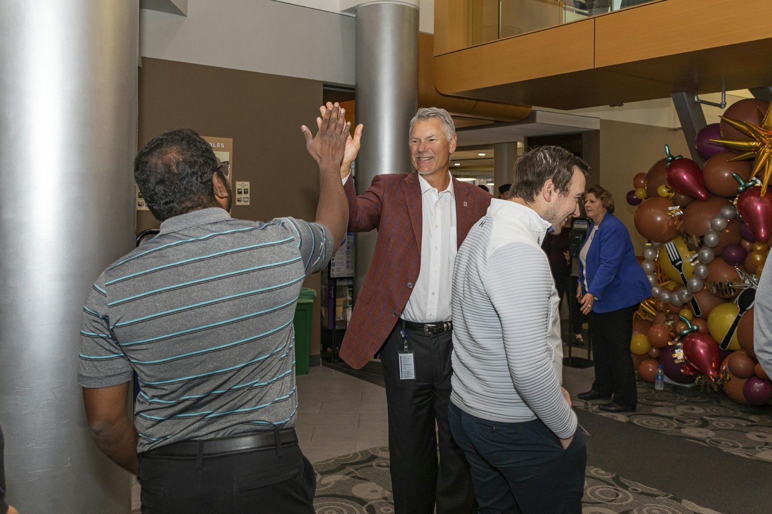 CEO Ray Kowalik greets employees at our annual new year kickoff event, Chili Bowl. 