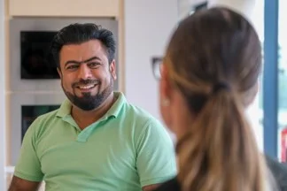 Mastercard employees in conversation. 