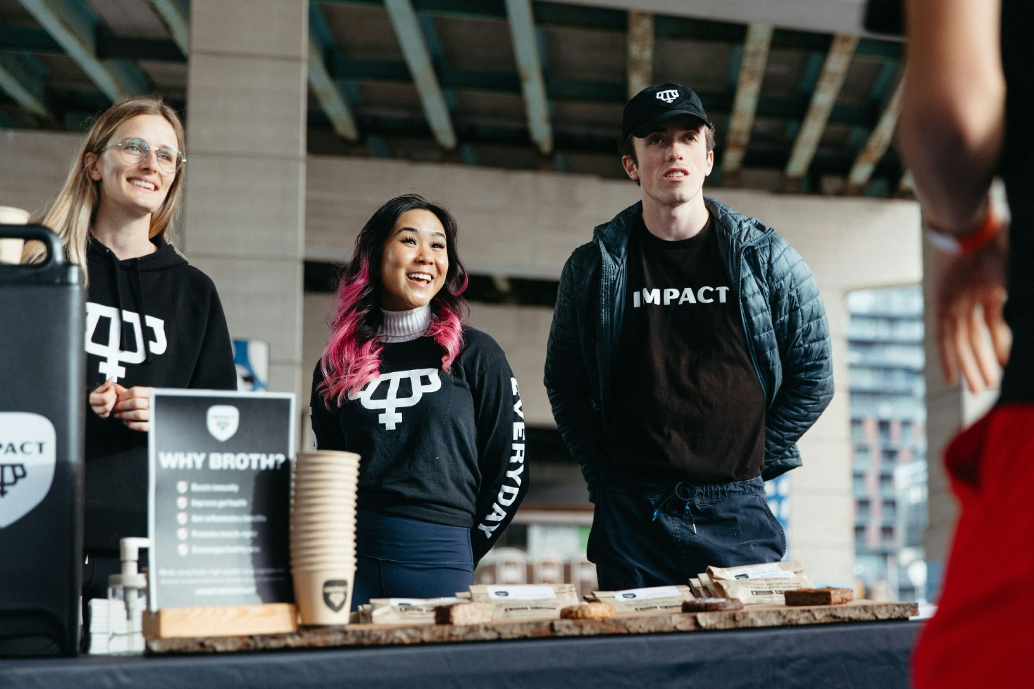 Team Impact giving out Baked Goods and Bone Broth after a marathon 