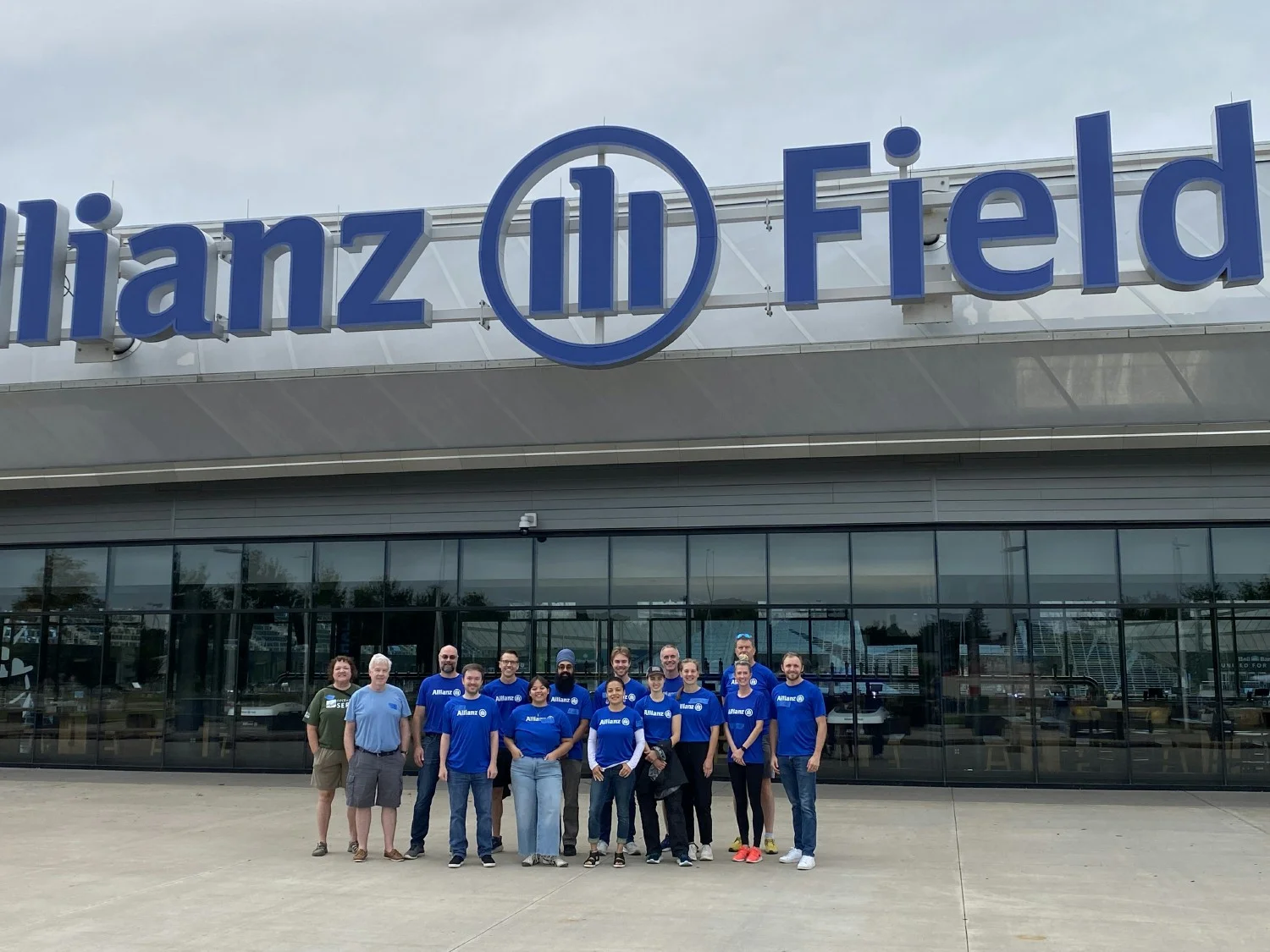 Employees volunteer at the Free Farmers Market held at Allianz Field.