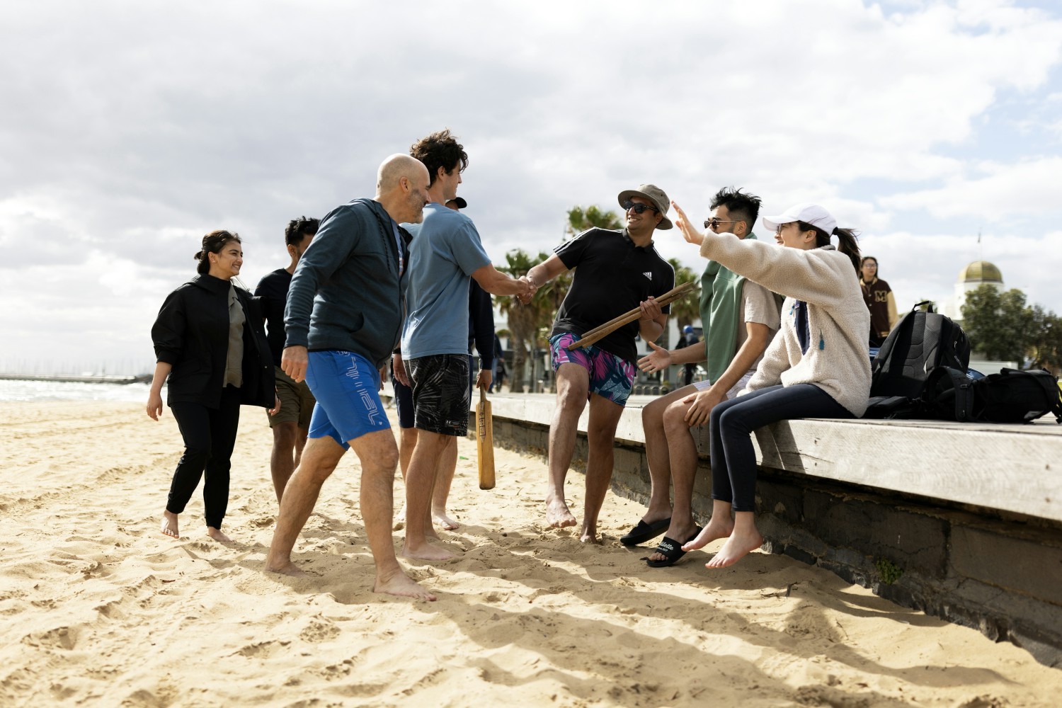 Quantexans join for Melbourne beach rounders - where fun meets competitive spirit. 