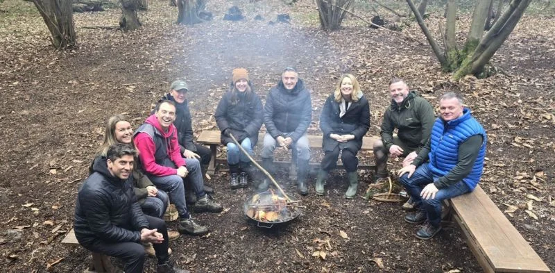 The System1 Exec team gathered around the campfire: bonding, sharing ideas, and building connections for the year ahead.