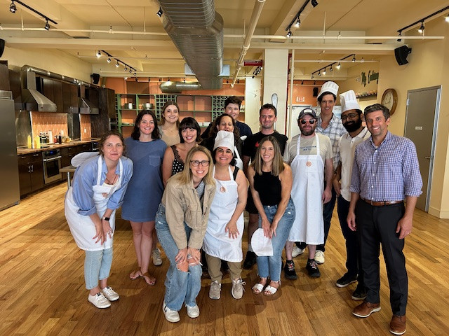 US teams at our NYC workshop: collaborating, learning, and building connections during a fun cooking session.