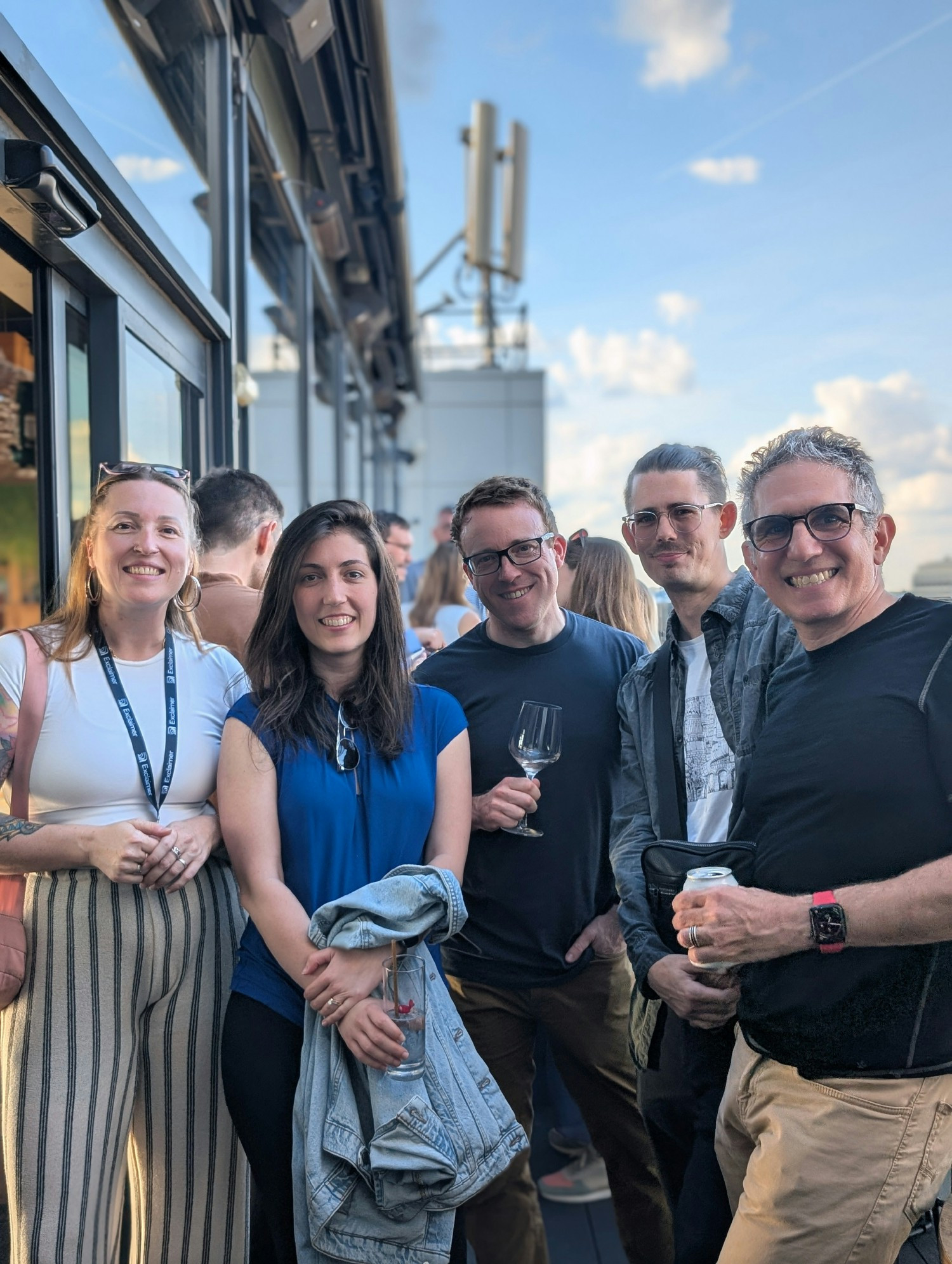 Members of our UK team getting together to celebrate at our UK summer rooftop party in central London