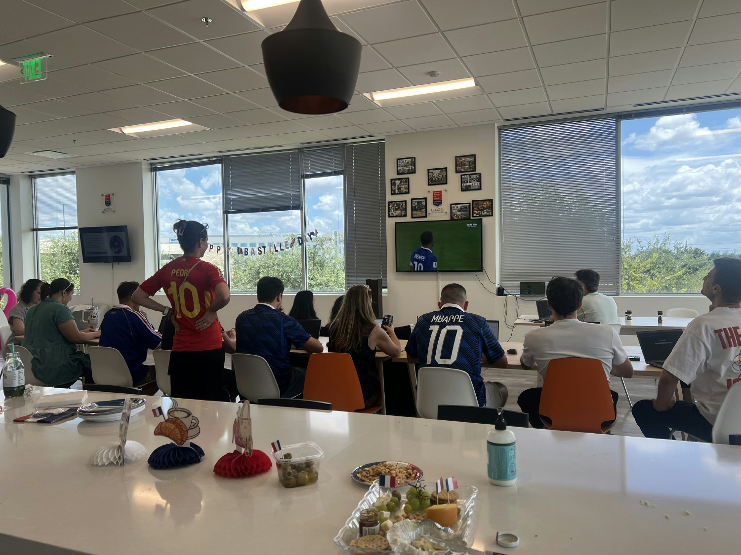 Yooz Inc. employees celebrating Bastille Day and watching soccer game for FIFA World Cup