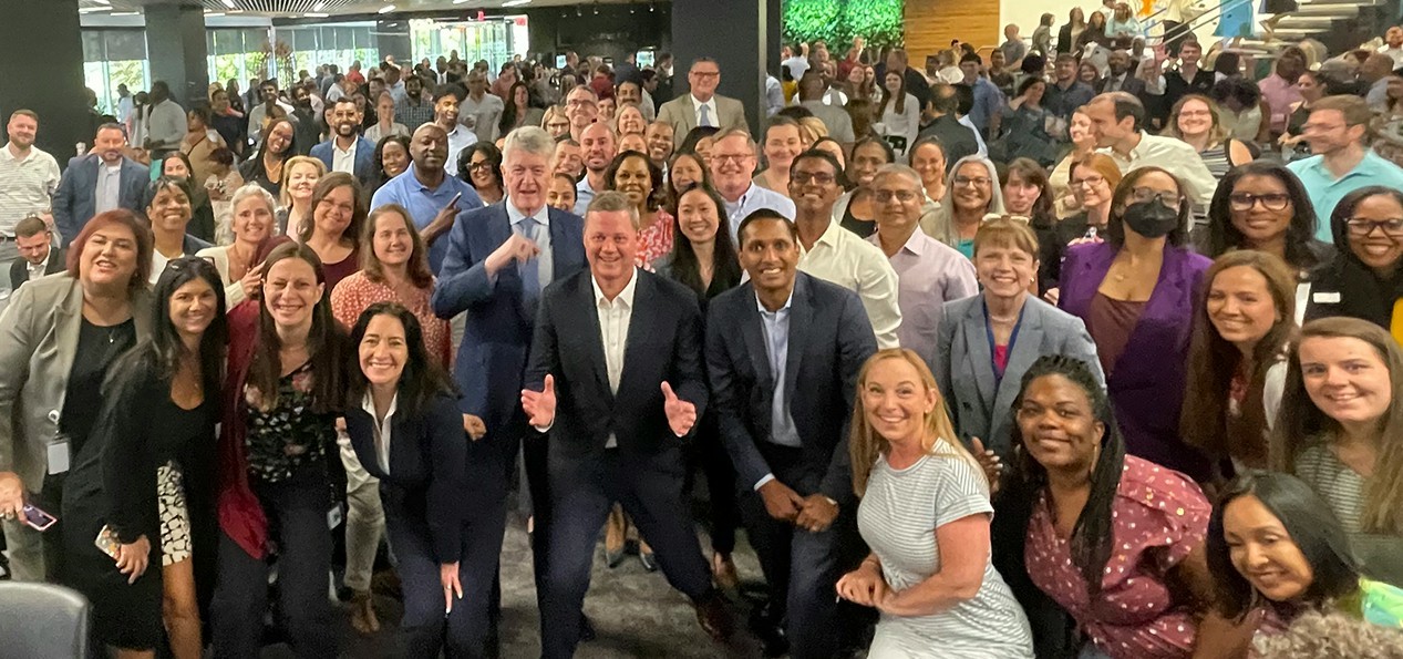 Charlotte employees join senior leaders for a supersized post town hall group selfie.