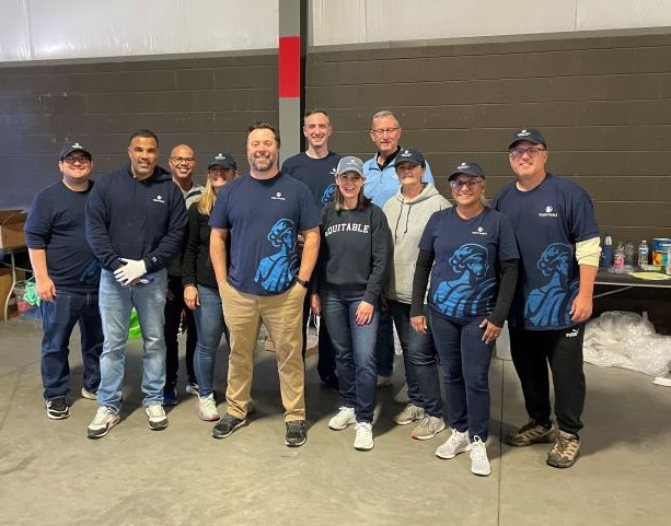 Equitable employees traveled to Asheville NC to provide support and assistance packing food and supplies in the wake of devastation caused by Hurricane Helene.