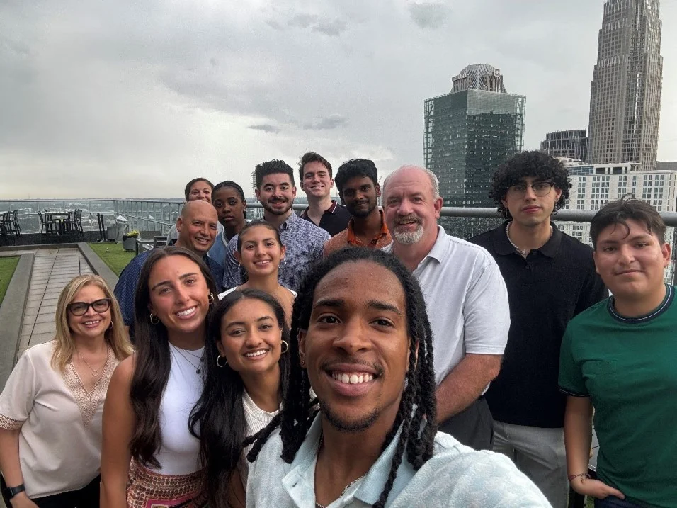 IT interns connecting and collaborating on their summer intern project, alongside our CIO Mike Healy