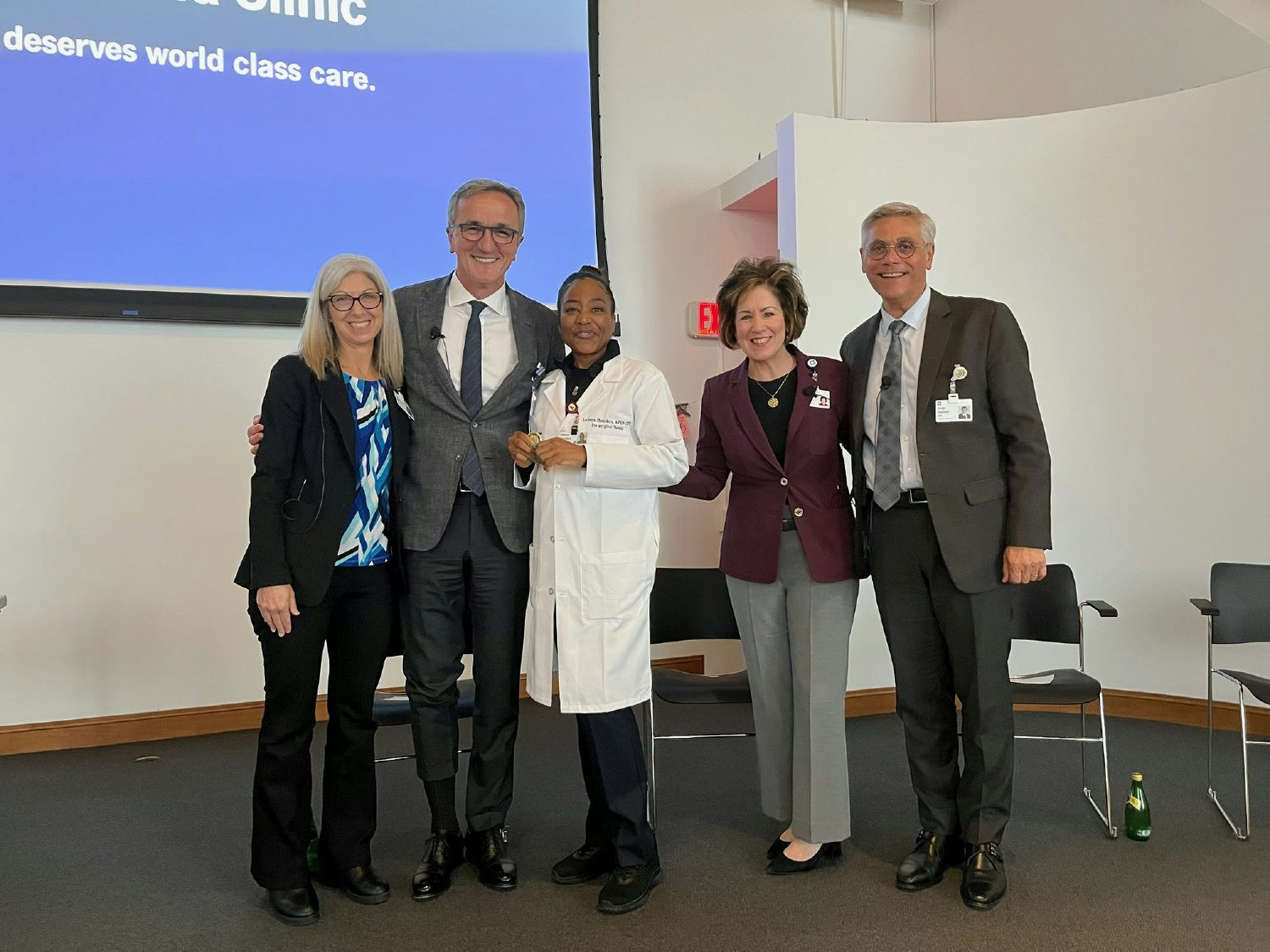 Our CEO and President recognizes a caregiver’s service by presenting her with a Legacy Coin during a CEO Town Hall.