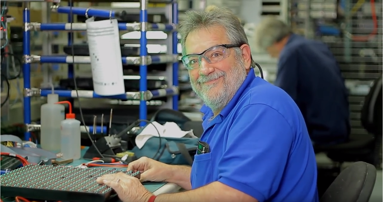 A Daktronics employee in our customer service repair center.