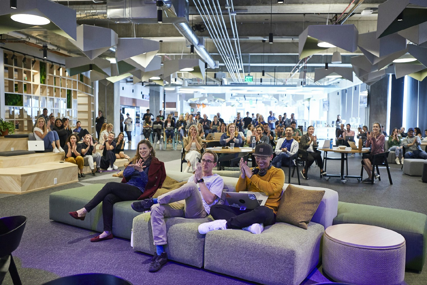 Atlassians collaborating together in person and virtually during our internal hackathon, ShipIt. 