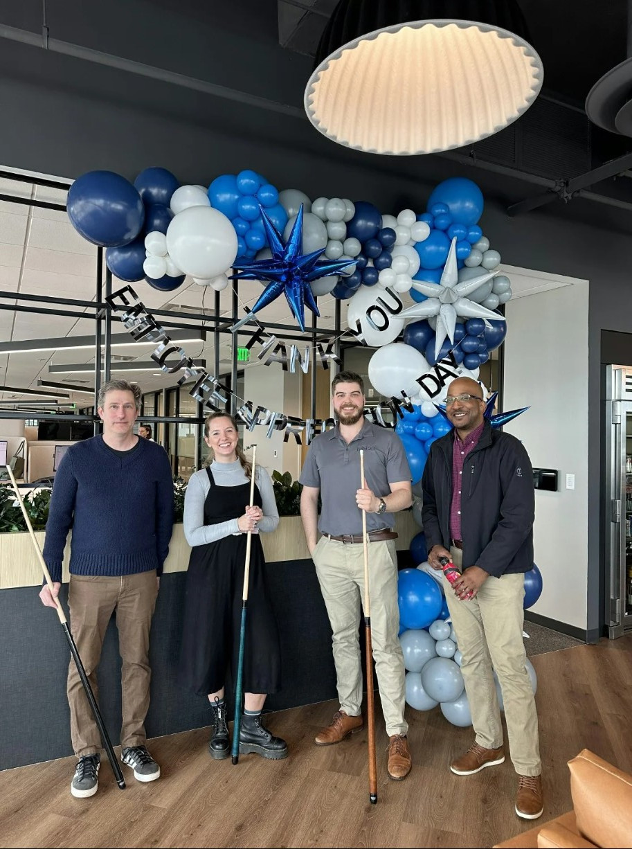 Team members take advantage of open collaboration spaces in the office to catch up on a project.