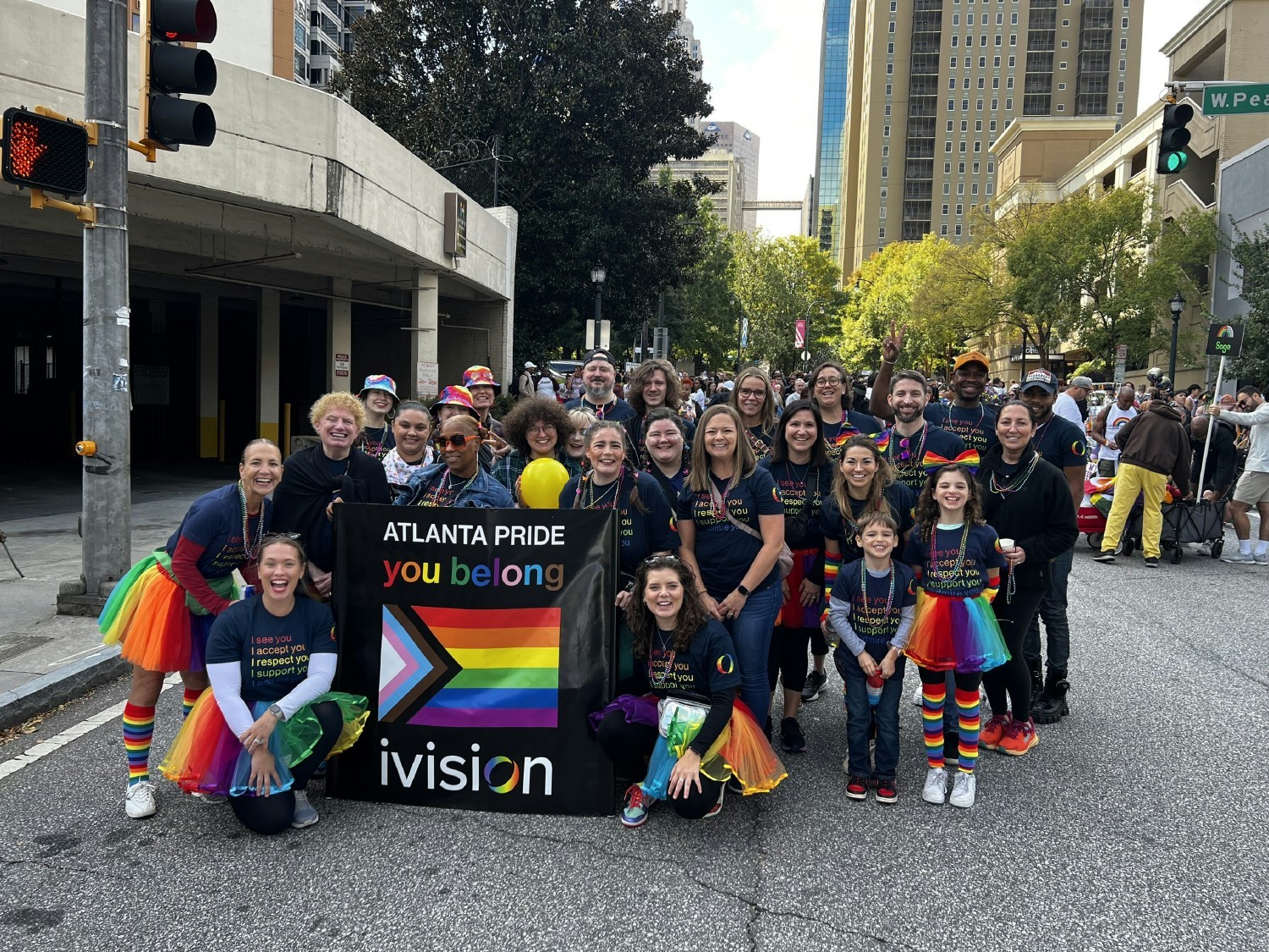 Team members represent ivision at the Atlanta Pride parade to share a message of belonging to the community.